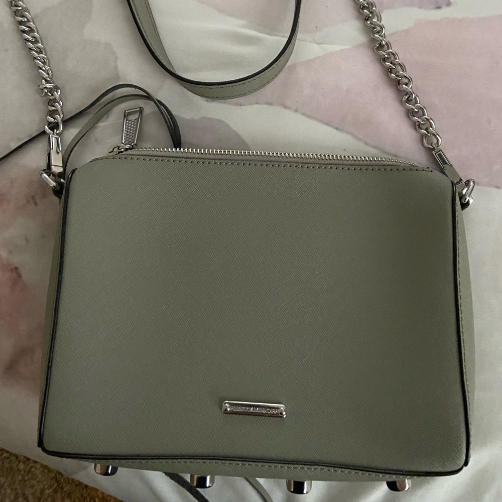 Leather bag with chain detail. Bottom has silver designs. Great shape like new.